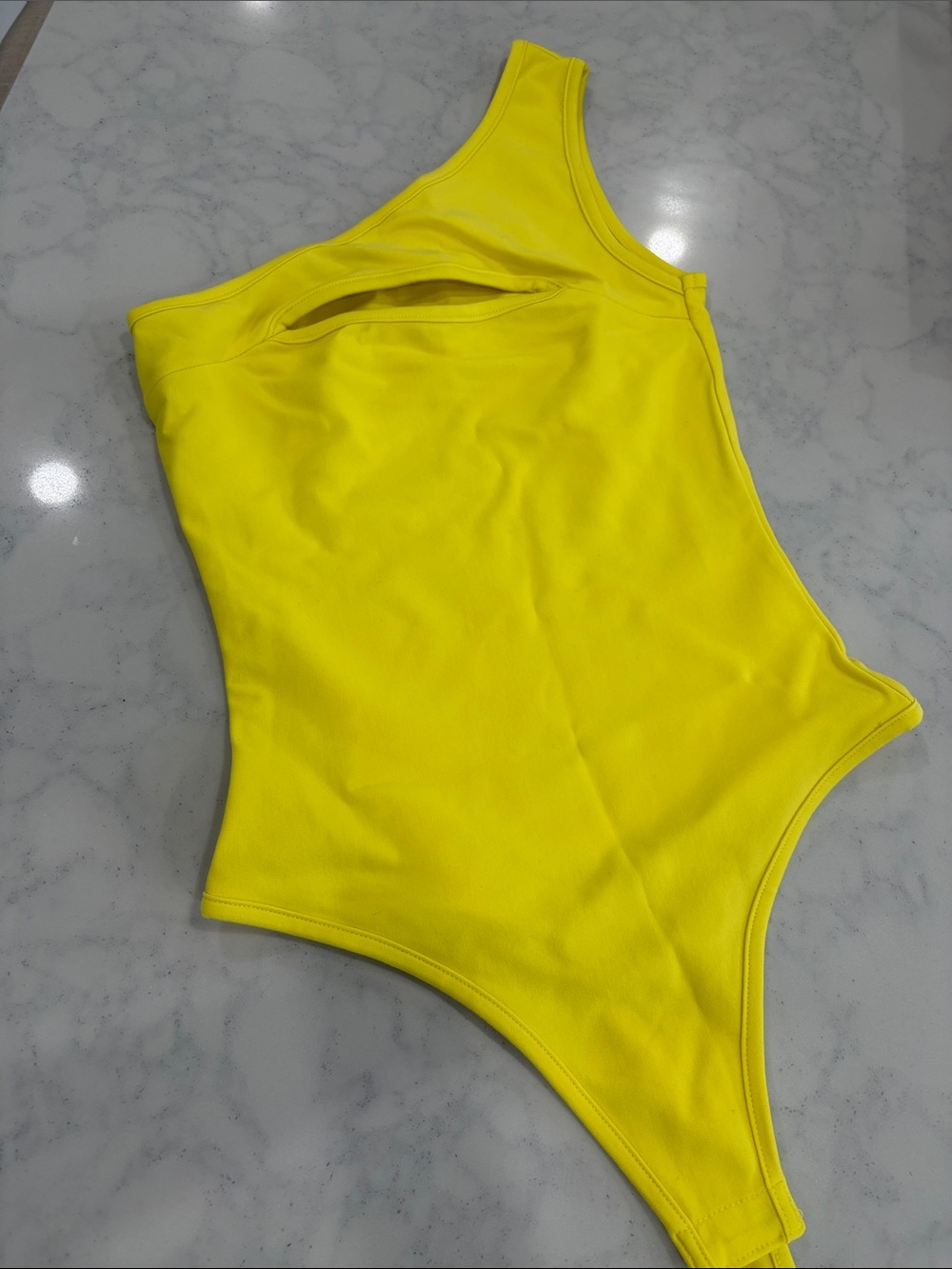 One shoulder yellow body suit